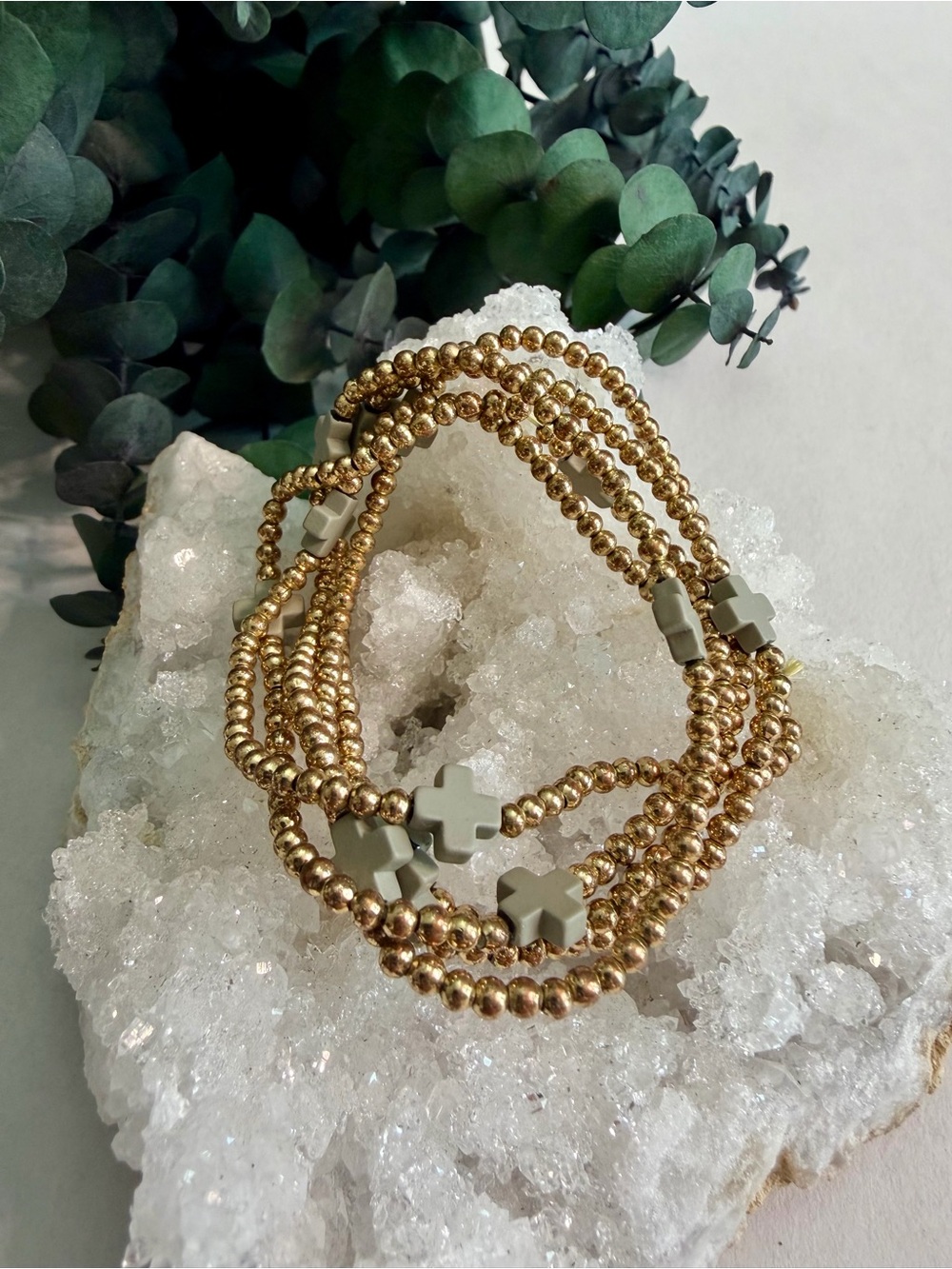 Gold-toned Beaded Bracelet Stack with Gray Cross Accents